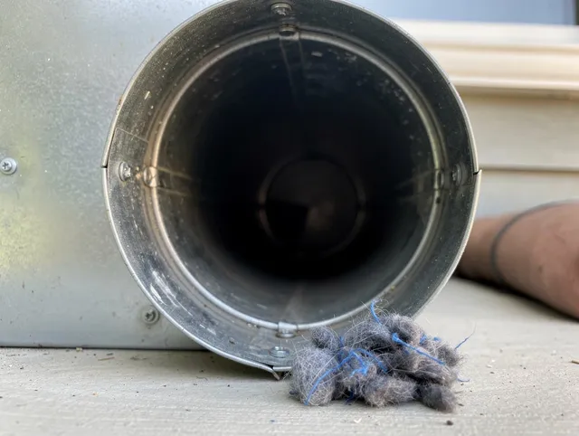 East Whittier Dryer Vent Cleaning technician using specialized equipment to clear severe dryer vent blockage in East Whittier